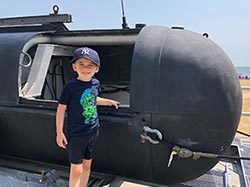 a child explores a helicopter