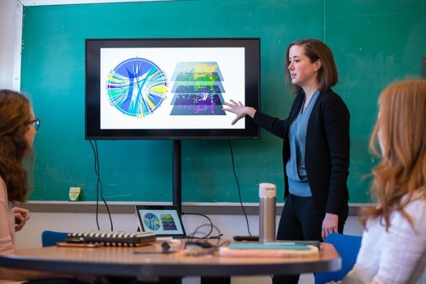 Assistant Professor Caitlin Grady explains a model to her research group