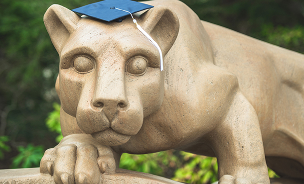 nittany lion statue wearing a mortar board