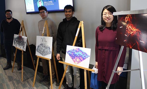 students pose with their winning Vizzies entries