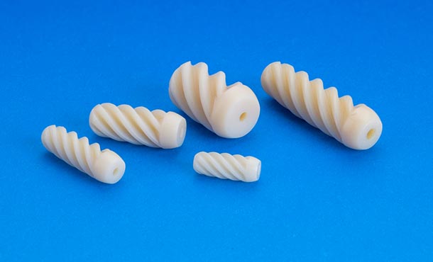 White screws lay on a blue background