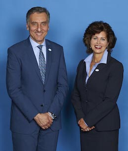 a man and a woman standing next to each other
