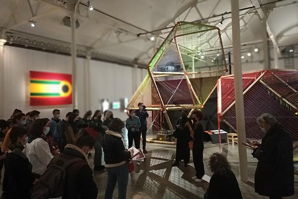 People observe an exhibit