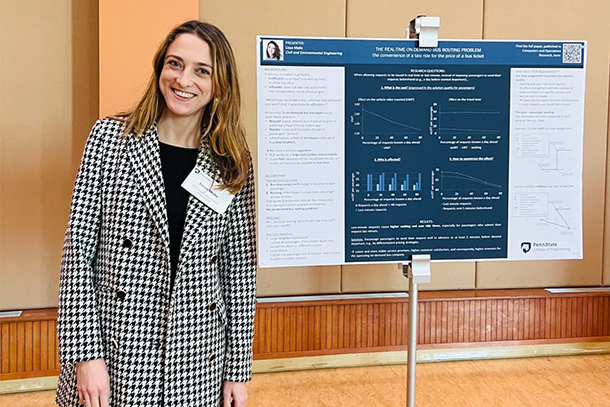 Lissa Melis stands to the left of research poster in large-scale ride-sharing systems at a research symposium.