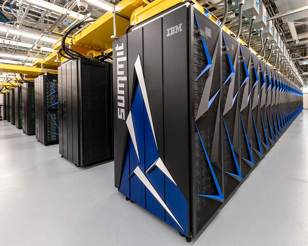 Rows of black and blue computer servers, with "Summit" written in white letters.