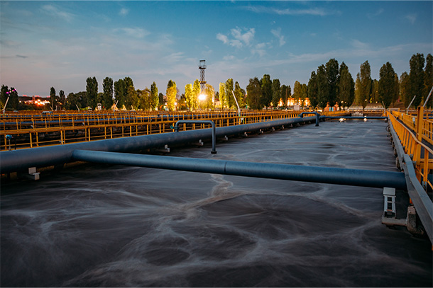 Modern wastewater treatment plant. Tanks for aeration and biological purification of sewage at sunset