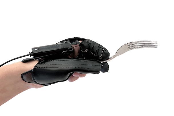 A hand in an exoskeleton holding a fork