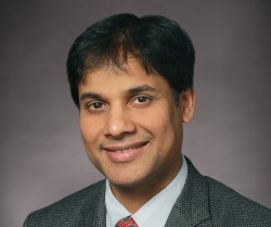 Raj Kothapalli in a suit and tie