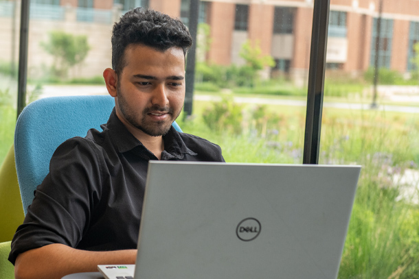 A student working at a laptop computer.