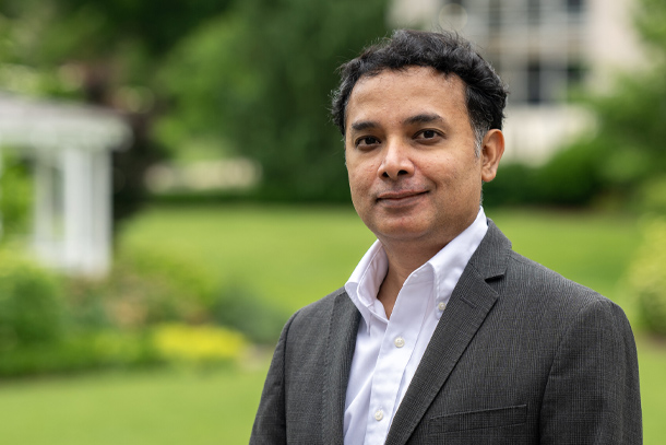 portrait of a person in a suit jacket standing outside