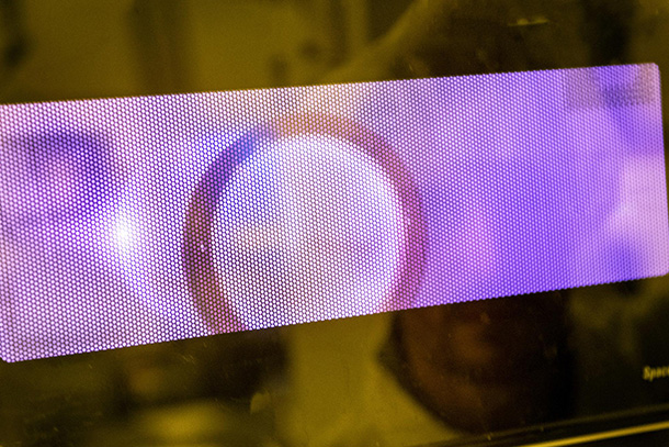 A purple slide with a circular pattern.