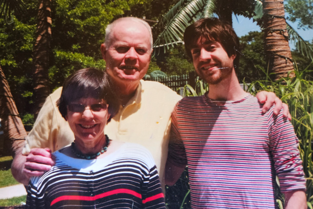  Three individuals pose for an outdoor portrait. 