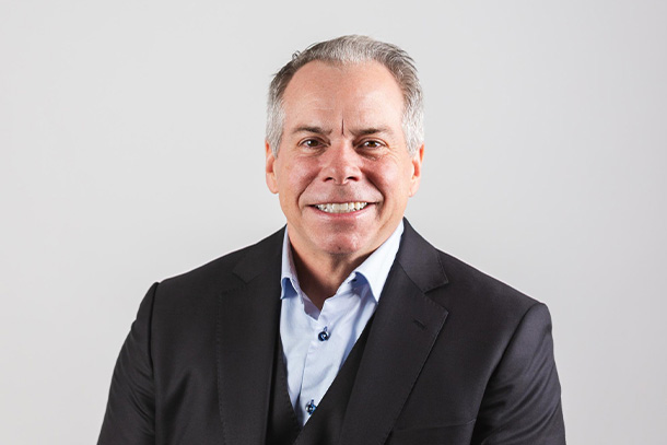 image of person smiling for camera in front of white background