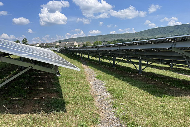 image of solar panels with gravel trenches running inbetween