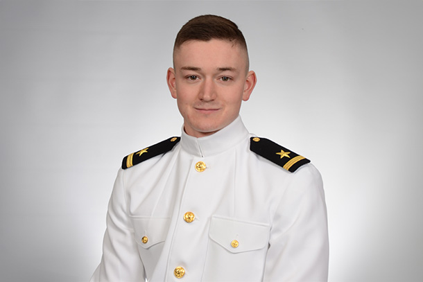 An individual in a military uniform poses for a formal portrait. 