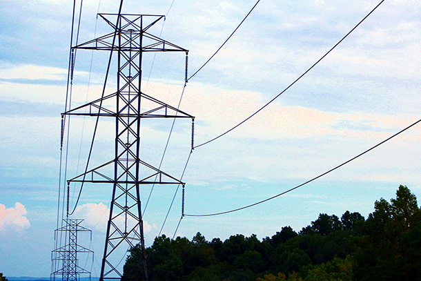 Power lines set in front of a blue sky