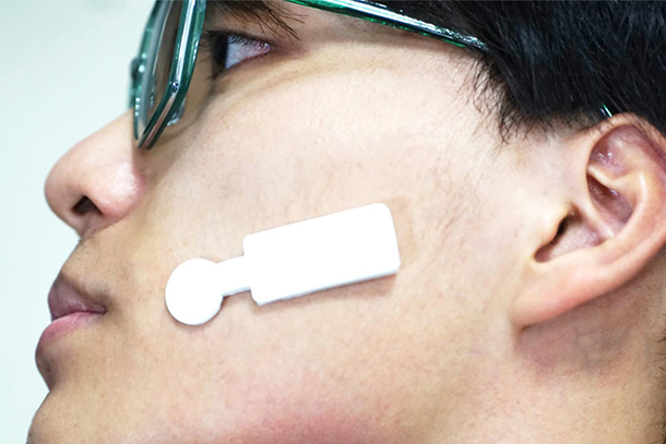 A sensor that tracks signals of emotion is places on a person's face 