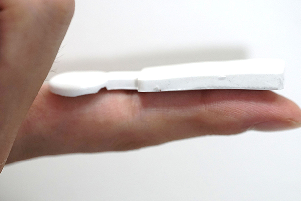 A sensor rests on an outstretched finger