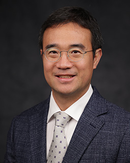 Associate professor of mechanical engineering poses for a headshot.