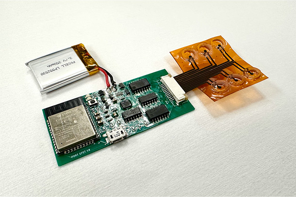 An electronic sensing device on a white background. 