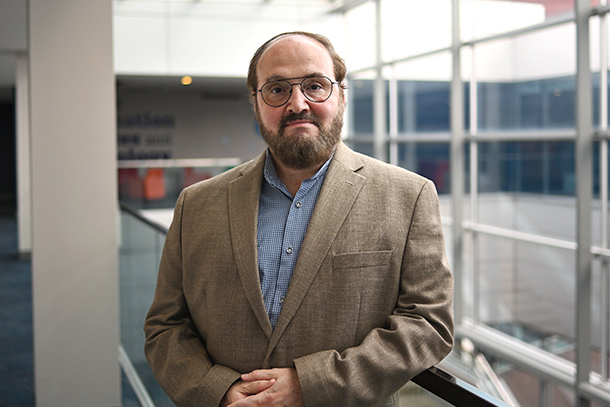 A distinguished professor at Penn State poses for a headshot.
