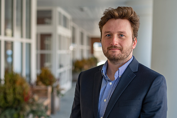 Headshot of person standing in building