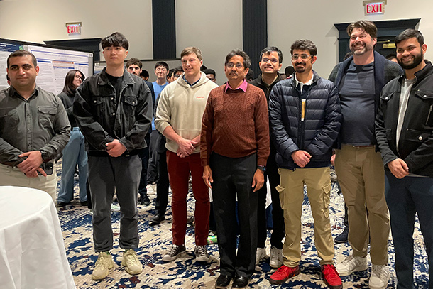 a group of people pose in a banquet room