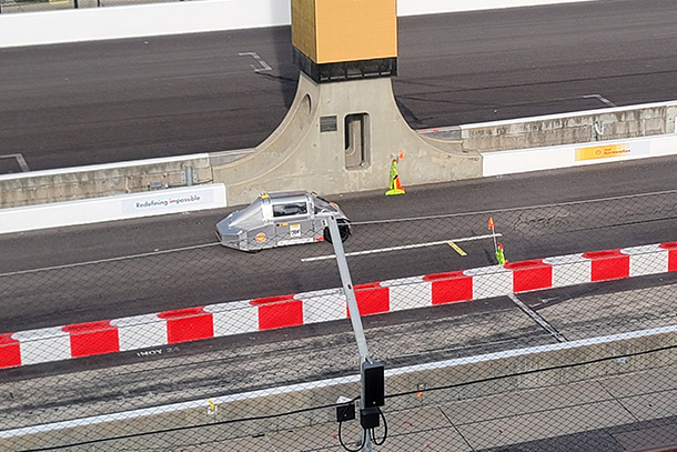 Picture of the car getting ready to drive on the raceway. 