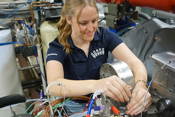 Person in lab putting probes on machine 