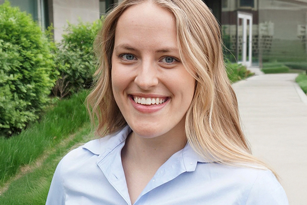 Person standing outside smiling at camera