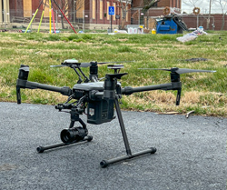 A drone sits on the ground